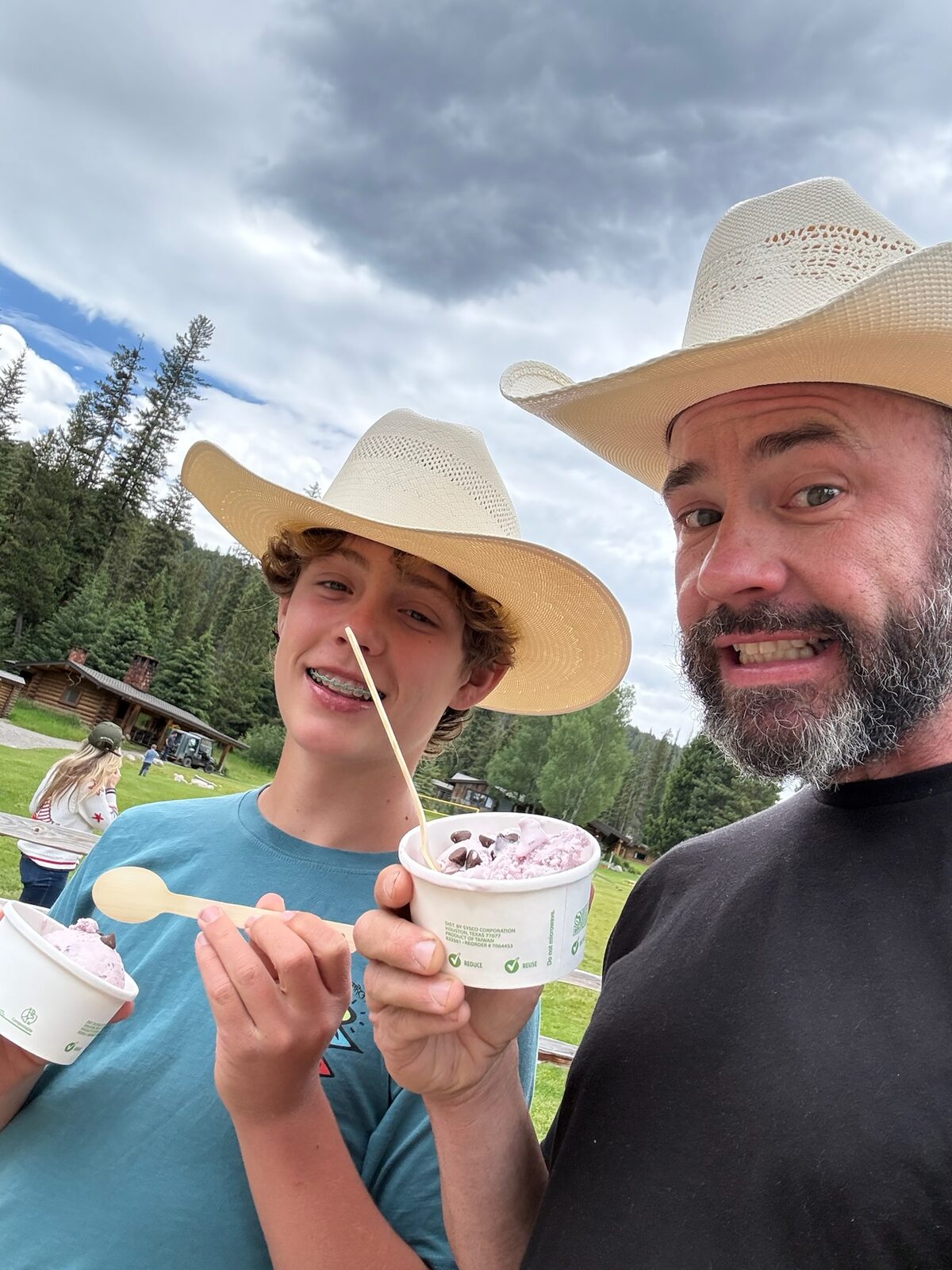 Mark and Dylan with ice cream cups in cowboy hats