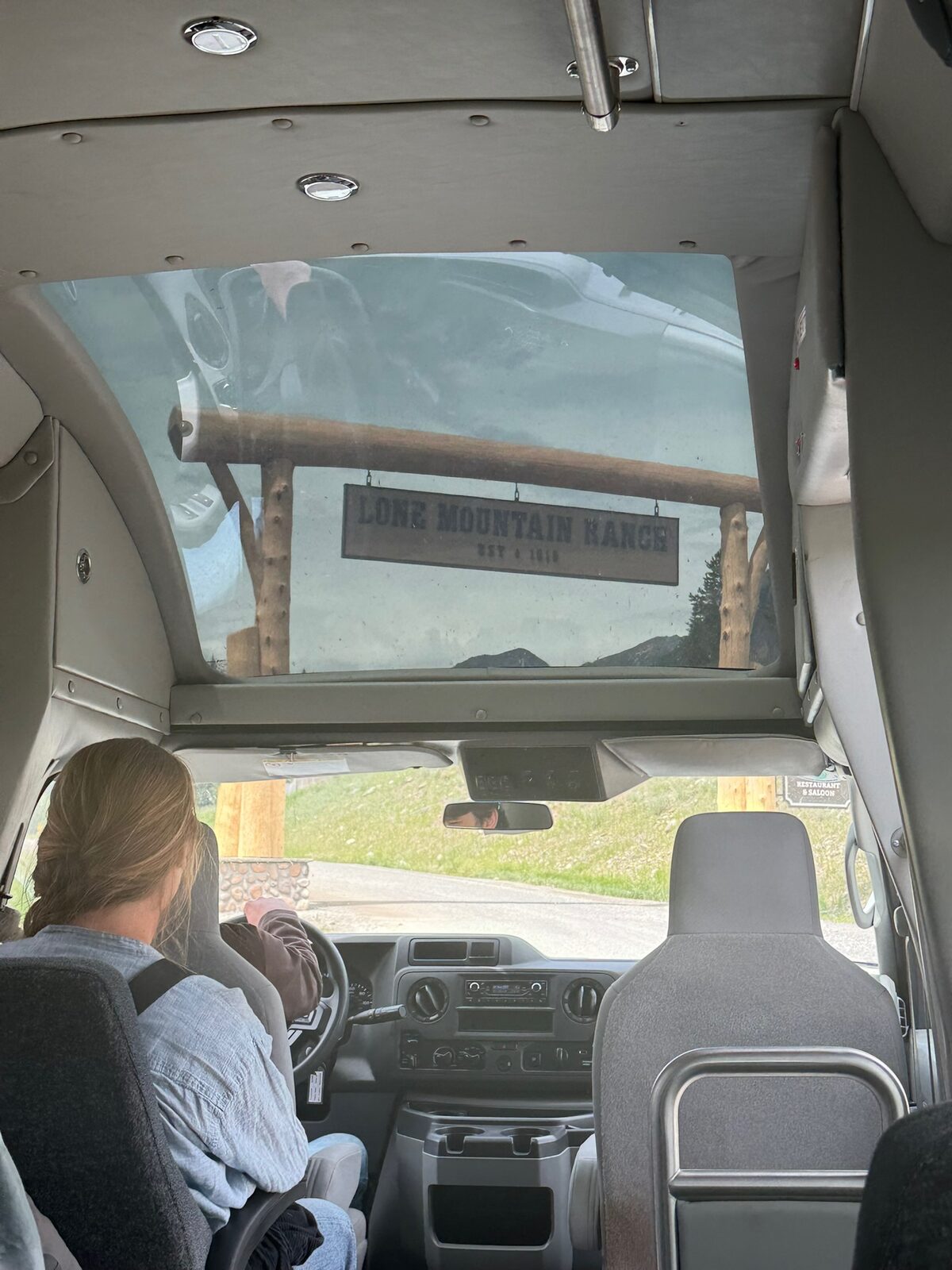 The Lone Mountain Ranch gate sign seen through the shuttle windshield